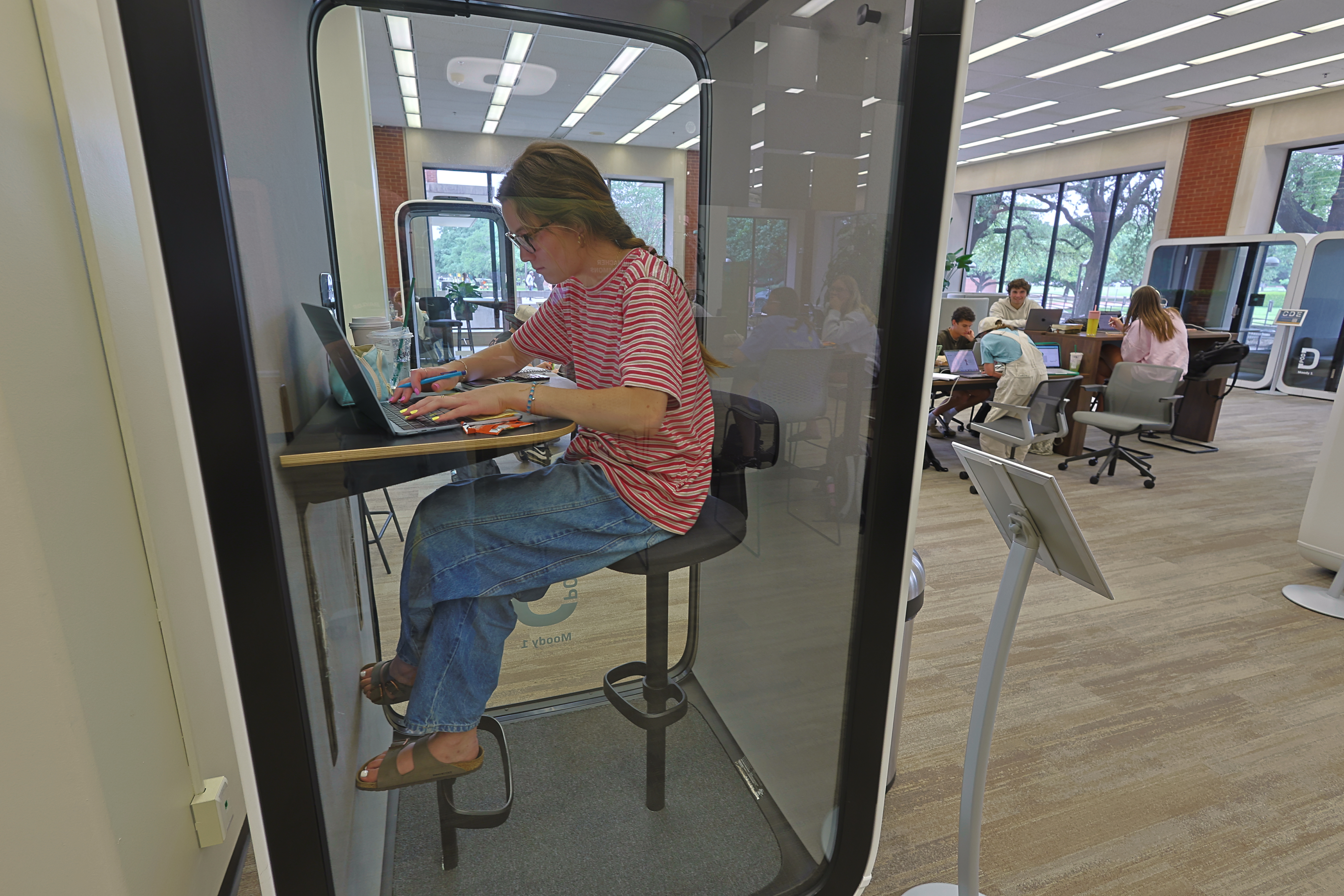 Baylor student studying in library pod